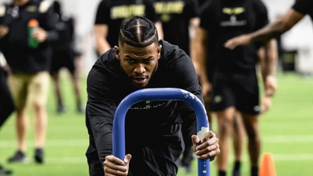 Shilo Sanders pushing a sled during offseason workouts at CU